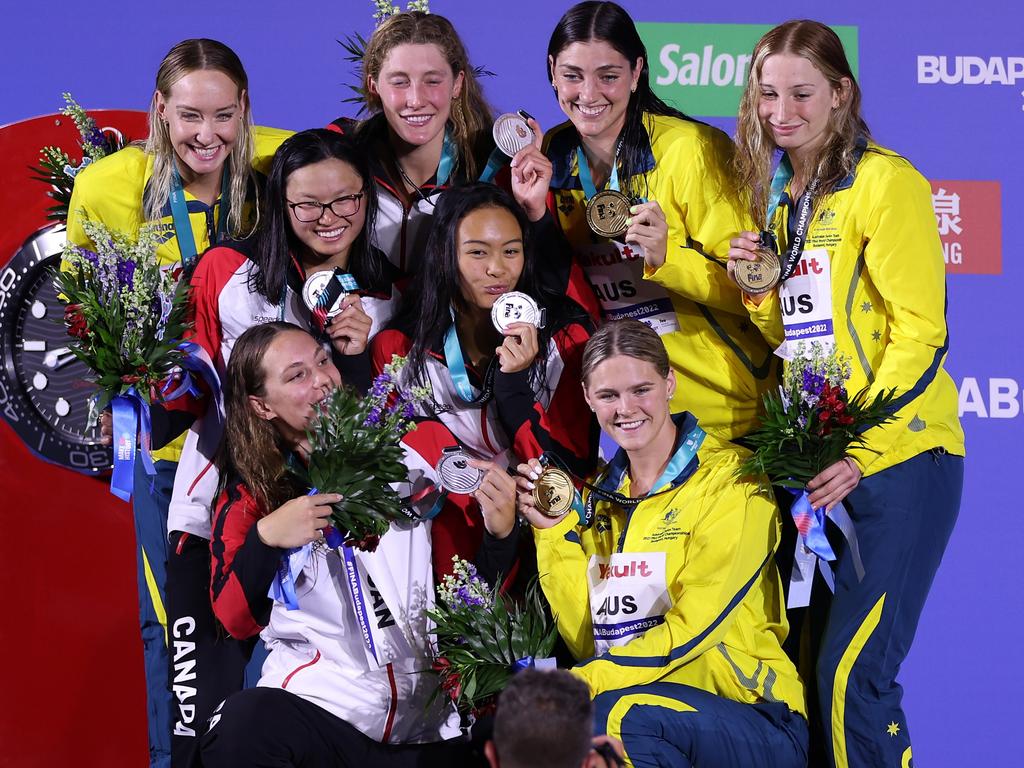 A sweet moment between the gold and silver medallists. Picture: Getty Images