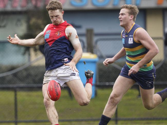 Old Brighton’s William Lewis in action against St Kevin’s.