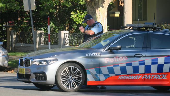 A highway patrol car blocks access to Gurwood Street via Simmons Street. Picture: Toby Vue