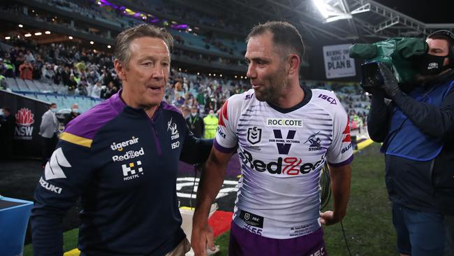 SYDNEY, AUSTRALIA - OCTOBER 25: Cameron Smith of the Storm celebrates with Storm coach Craig Bellamy after winning the 2020 NRL Grand Final match between the Penrith Panthers and the Melbourne Storm at ANZ Stadium on October 25, 2020 in Sydney, Australia. (Photo by Cameron Spencer/Getty Images)