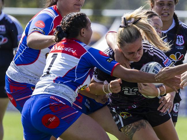 Kate Fallon is tackled by Rikka Lamb. Picture: Andrea Francolini