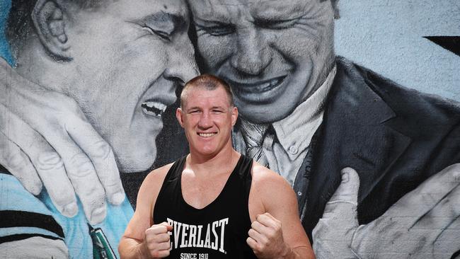 Paul Gallen in front of a Cronulla mural depicting him with Sharks great Andrew Ettinghausen after the Sharks’ maiden premiership in 2016. Picture: Brett Costello