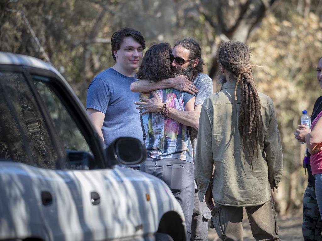 Lisa Groom (second from left) is comforted by friends. Picture: AAP.