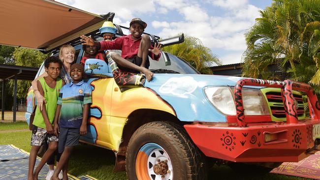 Daniel, Elias, Travis, Alison Kinnane and Aldrick celebrate the launch of the Big Sky Classroom program during the Maningrida College 60th Anniversary on Friday, August 10, 2018. Picture: Keri Megelus