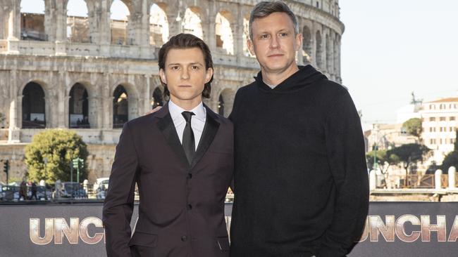 Actor Tom Holland and director Ruben Fleischer attend a photocall at Palazzo Manfredi for their new video game movie Uncharted.