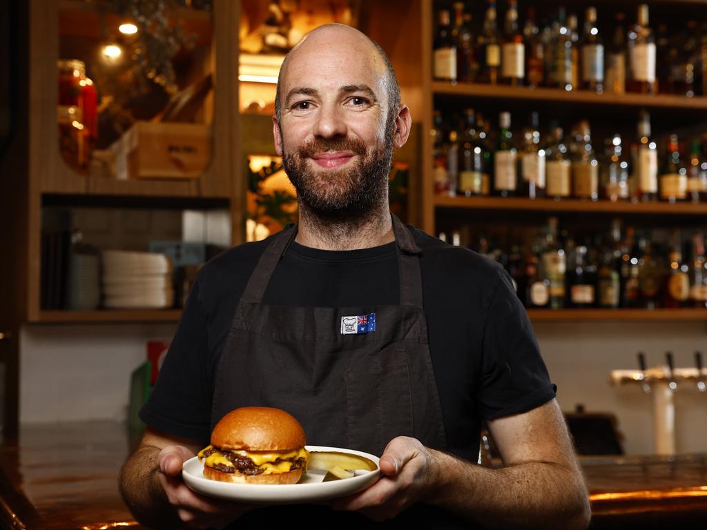 Chef Pip Pratt with the Gidley Burger at The Rover in Surry Hills which has been named as Australia's best burger. Picture: Jonathan Ng