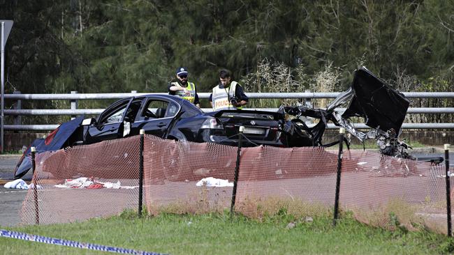 Police look over the crime scene this morning. Picture: Adam Yip / Second Story