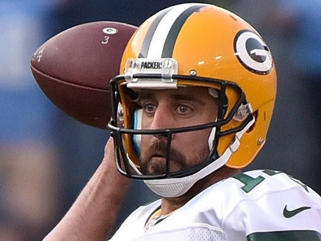 NASHVILLE, TN - NOVEMBER 13: Derrick Morgan #91 of the Tennessee Titans holds the legs of quarterback Aaron Rodgers #12 of the Green Bay Packers during the second half at Nissan Stadium on November 13, 2016 in Nashville, Tennessee. Frederick Breedon/Getty Images/AFP == FOR NEWSPAPERS, INTERNET, TELCOS & TELEVISION USE ONLY ==