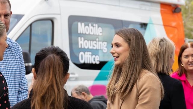 Housing Minister Meaghan Scanlon talking to service providers at the Connect 2 Home event at Carrara Stadium.