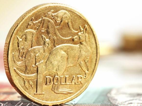 Aussie one dollar coins, on a twenty dollar note.