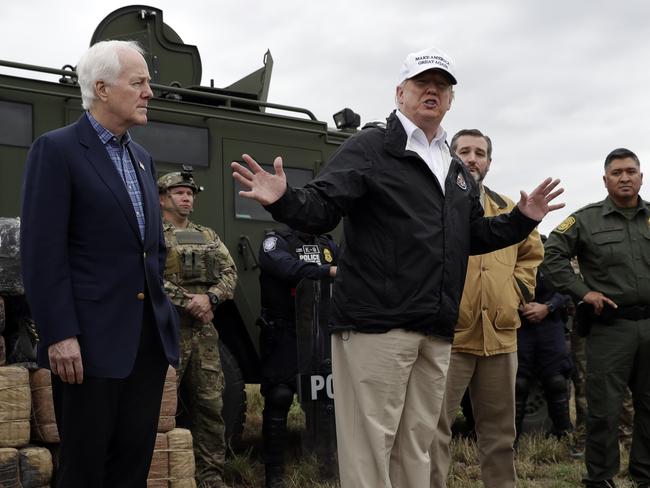 President Donald Trump speaks as tours the U.S. border with Mexico at the Rio Grande on the southern border, Thursday, Jan. 10, 2019, in McAllen, Texas, as Sen. John Cornyn, R-Texas, left, and Sen. Ted Cruz, R-Texas, listen. (AP Photo/ Evan Vucci)