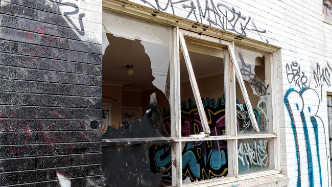 Broken windows and graffiti are common at this one-time mansion on Beach Rd, Beaumaris. Picture: Mark Dadswell