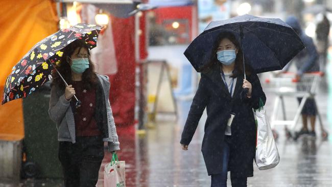 Sydneysiders wearing masks in the street in Chatswood on Friday. Picture: NCA NewsWire/Damian Shaw