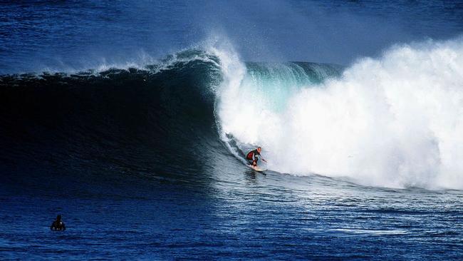 A surfer tames the Queenscliff bombora. Picture: Mark Taylor