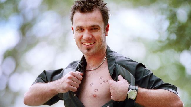 The star with his beloved Southern Cross tattoo.