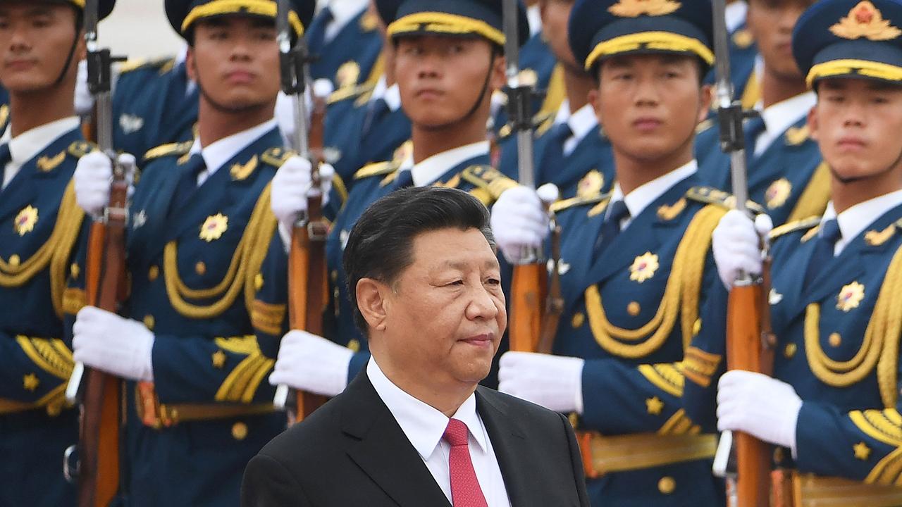 Chinese President Xi Jinping walking past a military honour guard outside the Great Hall of the People in Beijing. Picture: Greg Baker/AFP