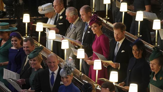 Back row from left, Britain's Queen Elizabeth II, Prince Philip, Prince Charles, Prince William, Kate, Duchess of Cambridge, Prince Harry, Meghan, Duchess of Sussex and Princess Anne, front row left to right, Sarah Ferguson, Princess Beatrice of York, Peter Phillips, Autumn Phillips, Mike Tindall, Zara Tindall, Lady Louise Mountbatten-Windsor and Crown Prince Pavlos of Greece. Picture: AP