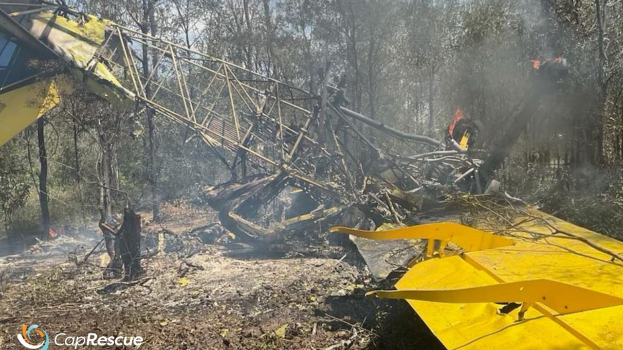 The burning wreckage of a crop-dusting plane that crashed near Baralaba. Picture: Capricornia Helicopter Rescue Service