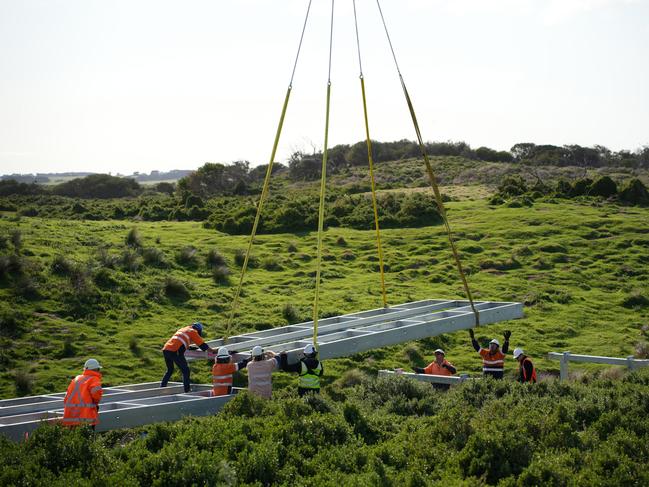 Steel framework was placed into fitted spaces on Summerland Beach with the assistance and guidance of on-site workers. Picture: Supplied