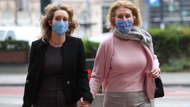 Holmes (L) walks with her mother Noel Holmes (R) as they arrive for court. Picture: Justin Sullivan/Getty Images/AFP