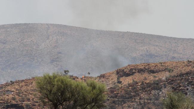 Small spot fires were visible from Larapinta Dr on Saturday afternoon. Picture: Gera Kazakov