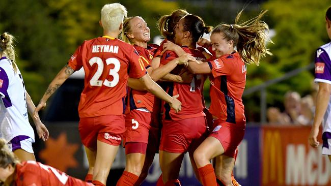 Adelaide United players celebrate Veronica Latsko’s second goal against Perth on Thursday night. Picture: AAP