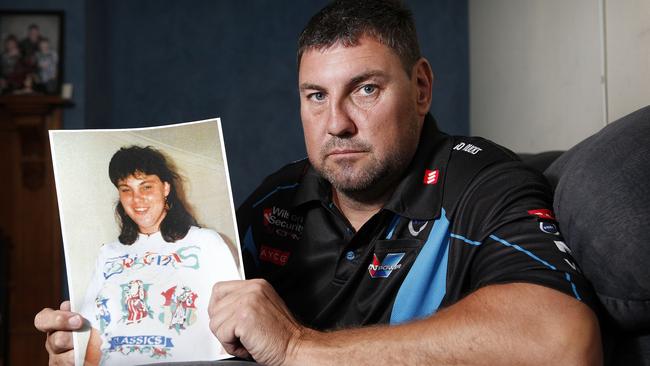 Peter King holds a picture of his murdered sister Gail King. Picture: Bianca De Marchi