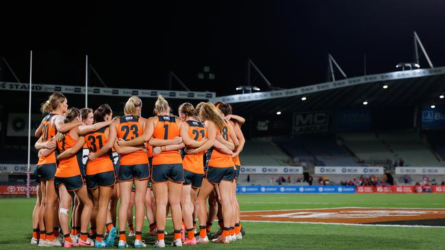 MELBOURNE, AUSTRALIA - OCTOBER 03: The GWS Giants huddle after a loss during the 2024 AFLW Round 06 match between the Melbourne Demons and the GWS GIANTS at IKON Park on October 03, 2024 in Melbourne, Australia. (Photo by Dylan Burns/AFL Photos via Getty Images)