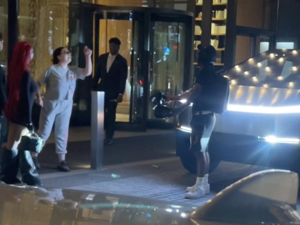 A row started after a resident of the apartment block came outside and shouted at people to leave the area. The resident is alleged to have then kicked a Cybertruck parked outside the building's lobby. Picture: SWNS