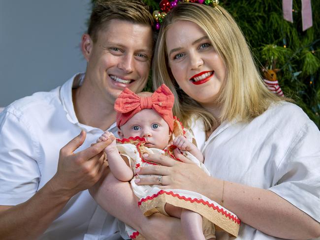 Hannah and Simon Potts with cutest spring baby winner Poppy 3 months in front of their Christmas tree at their Klemzig home .Thursday December,19,2025.Picture Mark Brake