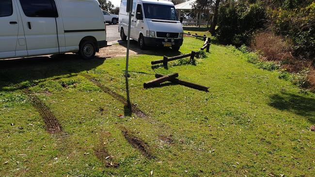 The timber barricades knocked over by a car which vandalised Green Point at Angourie