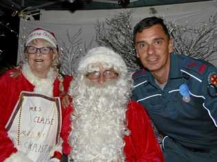 Mr and Mrs Santa Claus with local paramedic David Hornsby at the Tara Christmas Carnival. Picture: Eloise Quinlivan