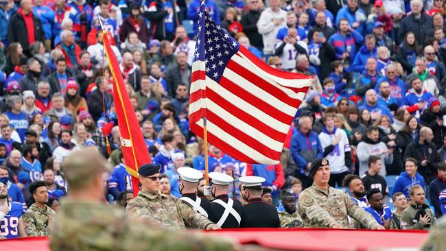 Service members hold the American flag during the national anthem before the game between the Indianapolis Colts and the Buffalo Bills. Picture: Getty Images