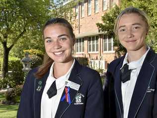 YOUNG STARS: St Ursula's College students Emily Ward (left) and Chloe Hutton are enjoying the challenges of representative football. Ward recently featured in the Australian touch team at the Youth World Cup and Hutton will play for the Queensland under-19 side at the School Sport Australia Football Championships. Picture: Bev Lacey