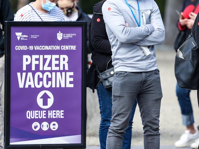 MELBOURNE, AUSTRALIA - NewsWire Photos 24 AUGUST 2021 : People line up at the Royal Exhibition Building in Carlton for their Covid-19 vaccination. Picture : NCA NewsWire / Ian Currie