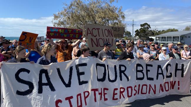 Around 100 residents have turned out at a previous LNP/Bundaberg Regional Council media conference calling for the Qld government to "urgently" approve works on the Woodgate beach sea wall project to protect the beach from further erosion.