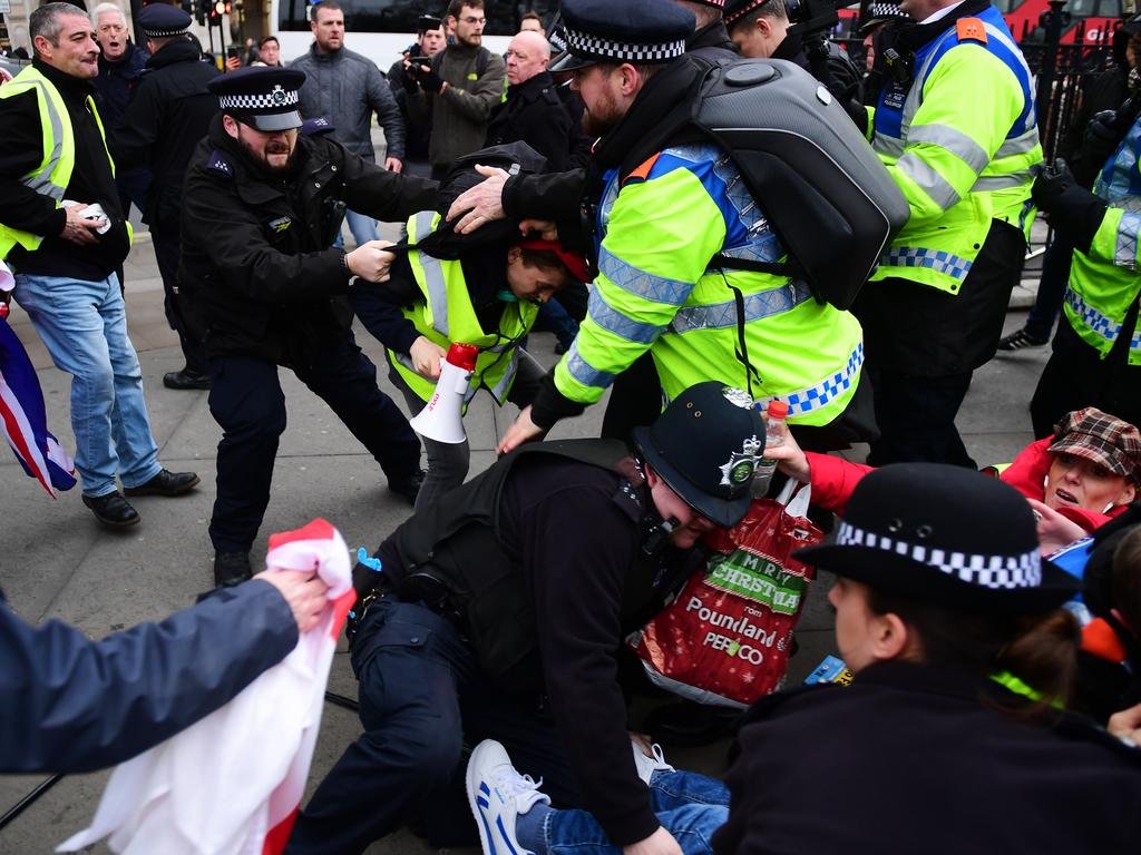 Demonstrators from pro and anti-Brexit camps clash during a protest in Trafalgar Square on Saturday in London. Picture: Chris J Ratcliffe/Getty Images