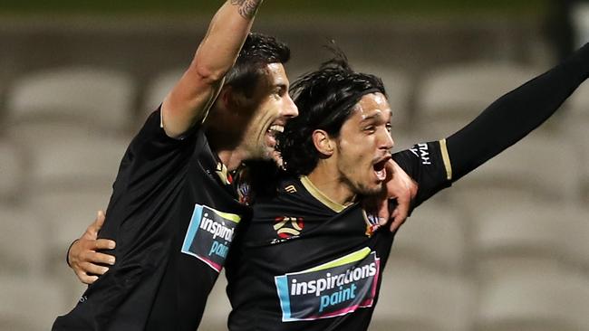 Jason Hoffman and Kosta Petratos of the Jets celebrate Petratos scoring the winner.