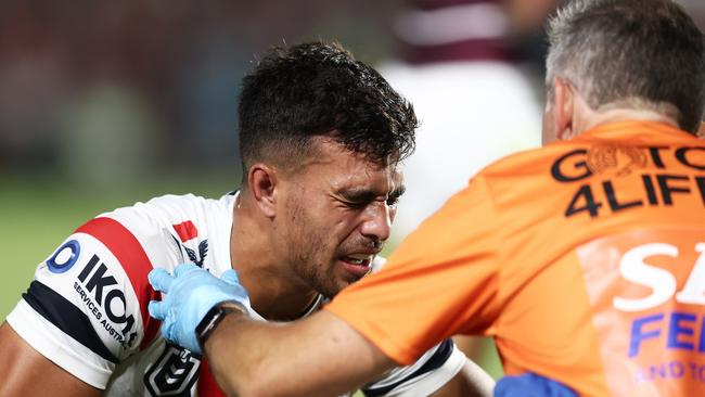 Joseph Suaalii is assisted on field after a head knock against the Sea Eagles at Central Coast Stadium in Gosford. Picture: Matt King/Getty Images