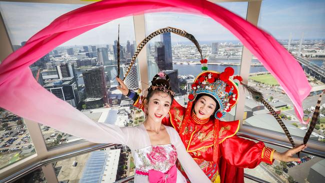 Dancers Eva Zhang and Qiaolan Jin prepare to celebrate the Year of the Dog in the Melbourne Star. Picture: Nicole Cleary