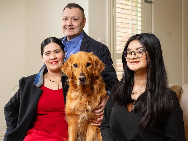 MELBOURNE, SEPTEMBER 25, 2024: Philip Stork and wife and Banly Borromeo with daughter Hayley, 16, and dog Nelson. Real Estate story. Picture: Mark Stewart