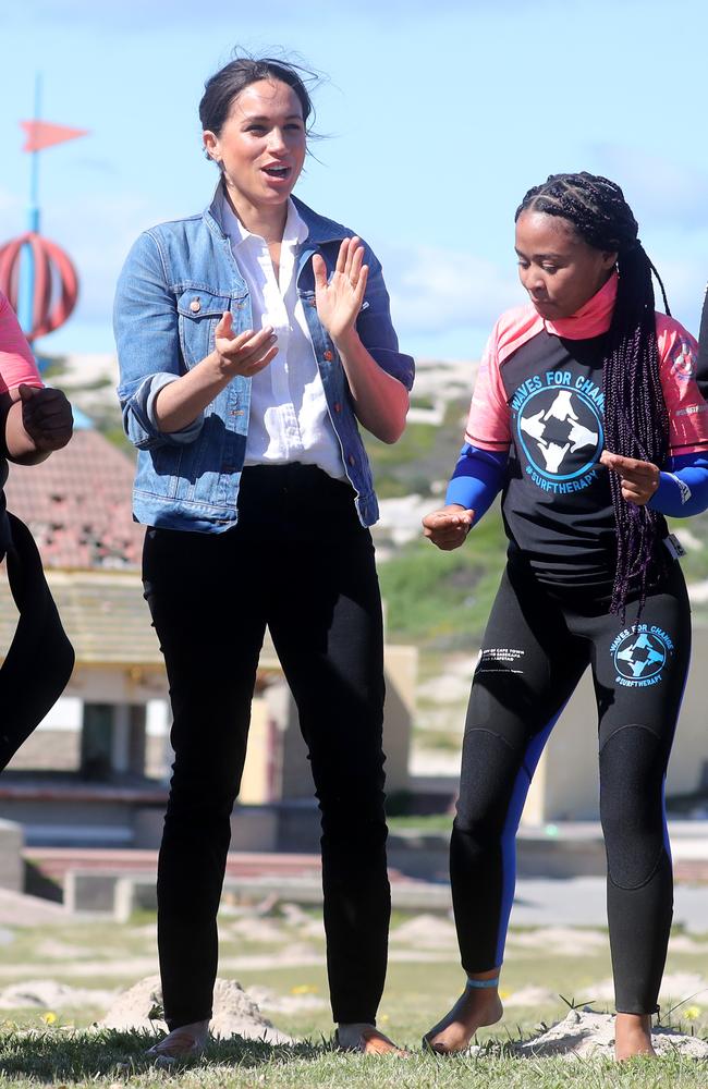 Meghan, Duchess of Sussex with surf mentors as she visits Waves for Change, an NGO, at Monwabisi Beach. Picture: Chris Jackson - Pool/Getty Images