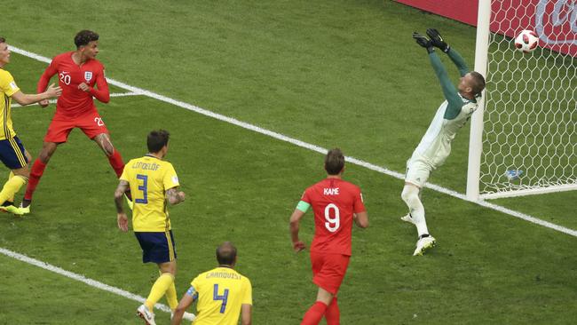 England’s Dele Alli, left, heads home his side’s second goal against Sweden in Samara. Picture: AP