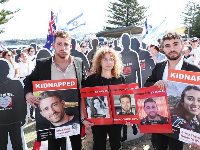 30/11/23: Ofir Tamir , Tali Kizhner and Amit Parpara at the media opportunity with the Israeli delegation at Bondi. John Feder/The Australian.