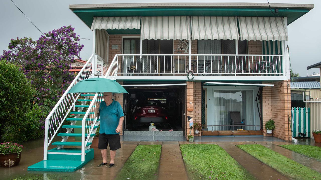 Flood waters on Sunshine Coast. Bradman avenue resident Allen Davies watches as the Maroochy River rises. Picture: Brad Fleet