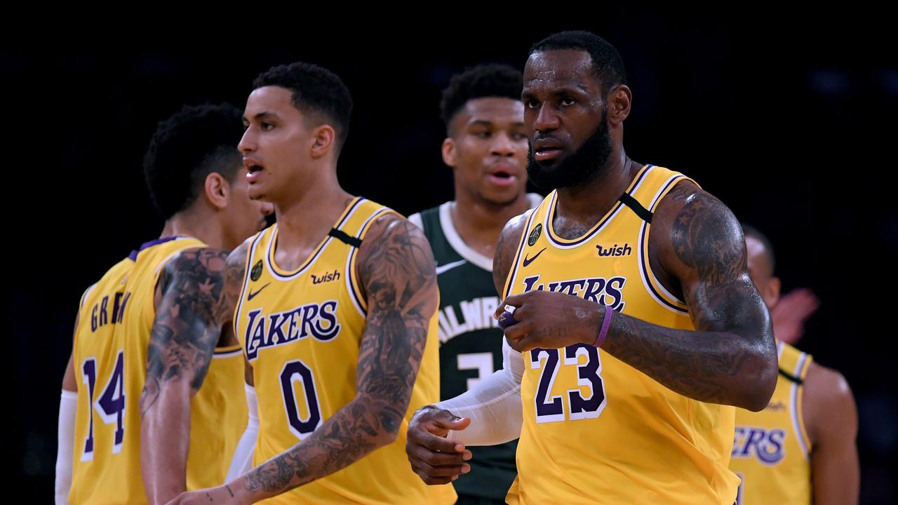 LOS ANGELES, CALIFORNIA - MARCH 06: LeBron James #23 and Kyle Kuzma #0 of the Los Angeles Lakers react after a James score, in front of Giannis Antetokounmpo #34 of the Milwaukee Bucks during a 113-103 Laker win at Staples Center on March 06, 2020 in Los Angeles, California. NOTE TO USER: User expressly acknowledges and agrees that, by downloading and or using this photograph, User is consenting to the terms and conditions of the Getty Images License Agreement. Harry How/Getty Images/AFP == FOR NEWSPAPERS, INTERNET, TELCOS &amp; TELEVISION USE ONLY ==