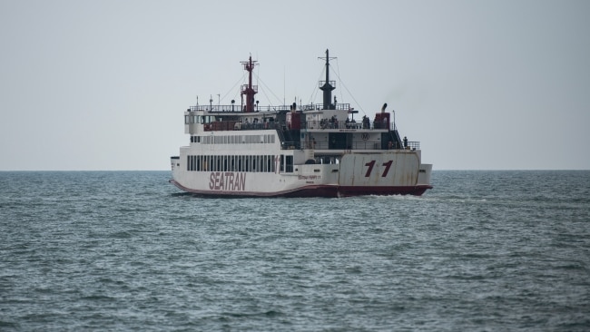 His body was taken by ambulance onto a ferry to be transported to the mainland for an autopsy. Picture: Sirachai Arunrugstichai/Getty Images