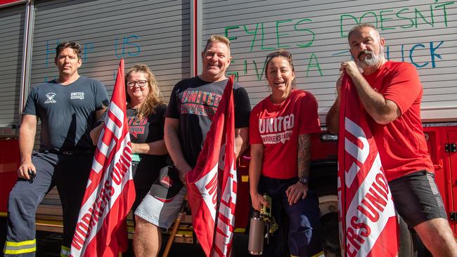 Katherine station officer Daniel Kenna, left, United Workers Union NT secretary Erina Early, Darwin leading firefighter Peter Jelly, Marrara senior firefighter Keeley Stewart, and Darwin station officer David Lines protesting the NT Government's pay offer. Picture: Pema Tamang Pakhrin