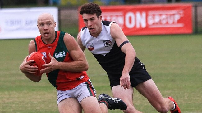 Josh Adams (The Basin) looks to give Jayden Cairns (Ringwood) the slip in the Eastern Football League (EFL). Picture: Davis Harrigan