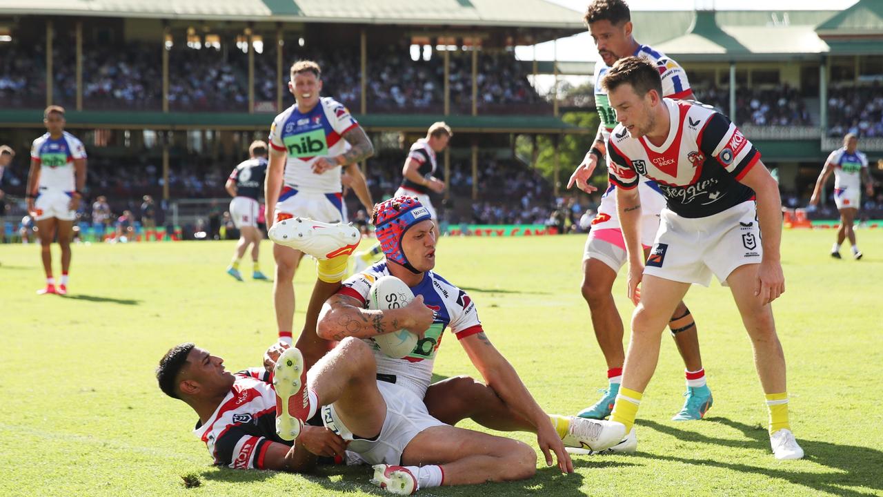 SYDNEY, AUSTRALIA - MARCH 12: Kalyn Ponga of the Knights is tackled during the round one NRL match between the Sydney Roosters and the Newcastle Knights at Sydney Cricket Ground, on March 12, 2022, in Sydney, Australia. (Photo by Matt King/Getty Images)